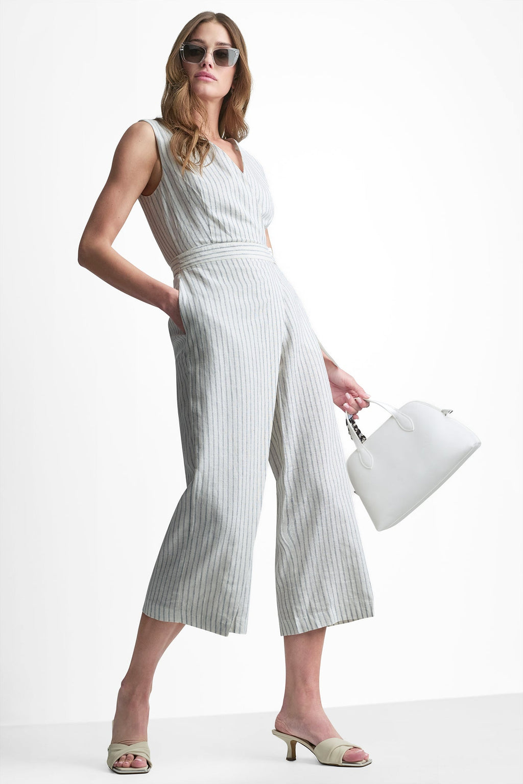 LINEN-BLEND SLEEVELESS WRAP-EFFECT STRIPED JUMPSUIT